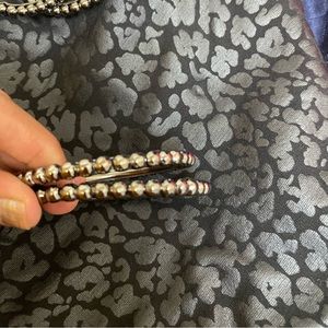 Black metal with polished bangles